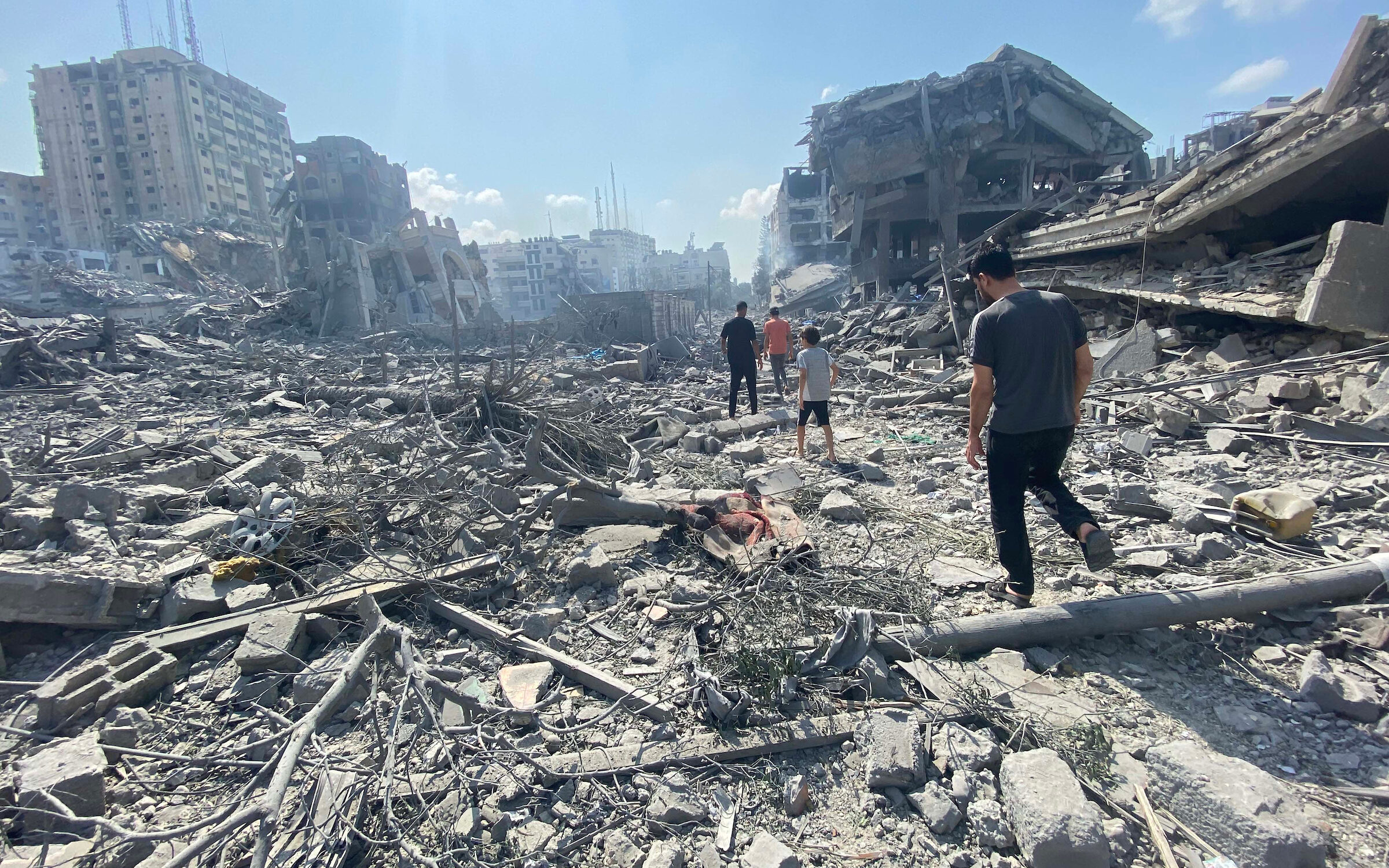 Palestinians inspect the damage following an Israeli airstrike on the El-Remal aera in Gaza City. (PHOTO CREDIT: Wikimedia via https://commons.wikimedia.org/wiki/File:Damage_in_Gaza_Strip_during_the_October_2023_-_27.jpg#/media/File:Damage_in_Gaza_Strip_during_the_October_2023_-_27.jpg)