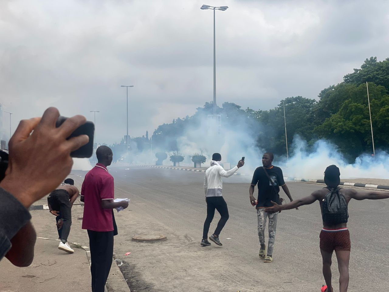 11:56 am: Protest turns rowdy as police fired multiple teargas at protesters at the three arms zone